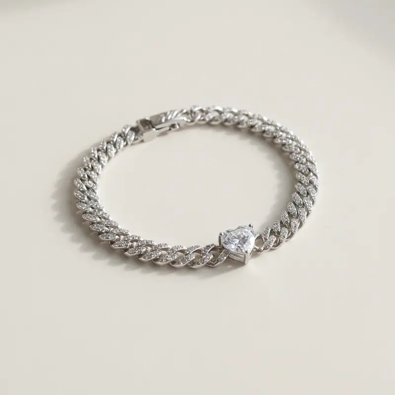 Clear heart pavé curb bracelet on an off-white surface