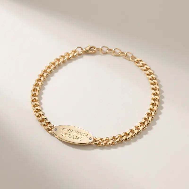 Love Your Dreams ID bracelet on an off-white surface