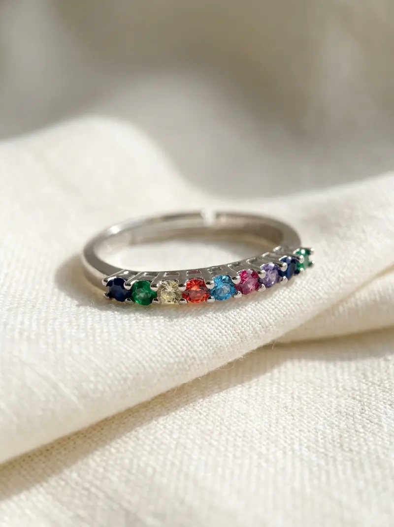 Close-up of the silver rainbow stone ring on folded linen