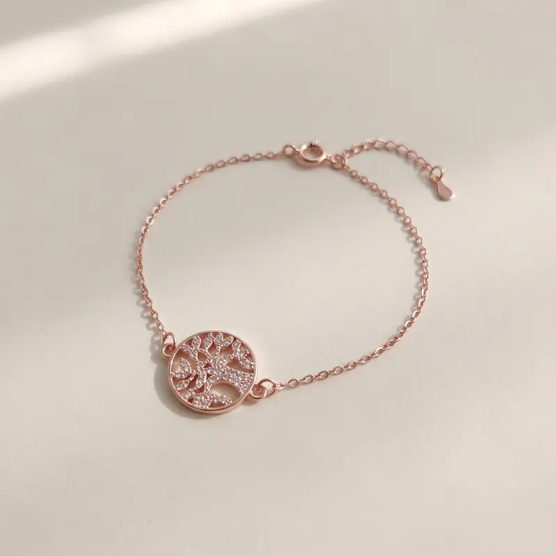 Tree of life bracelet on a warm off-white surface